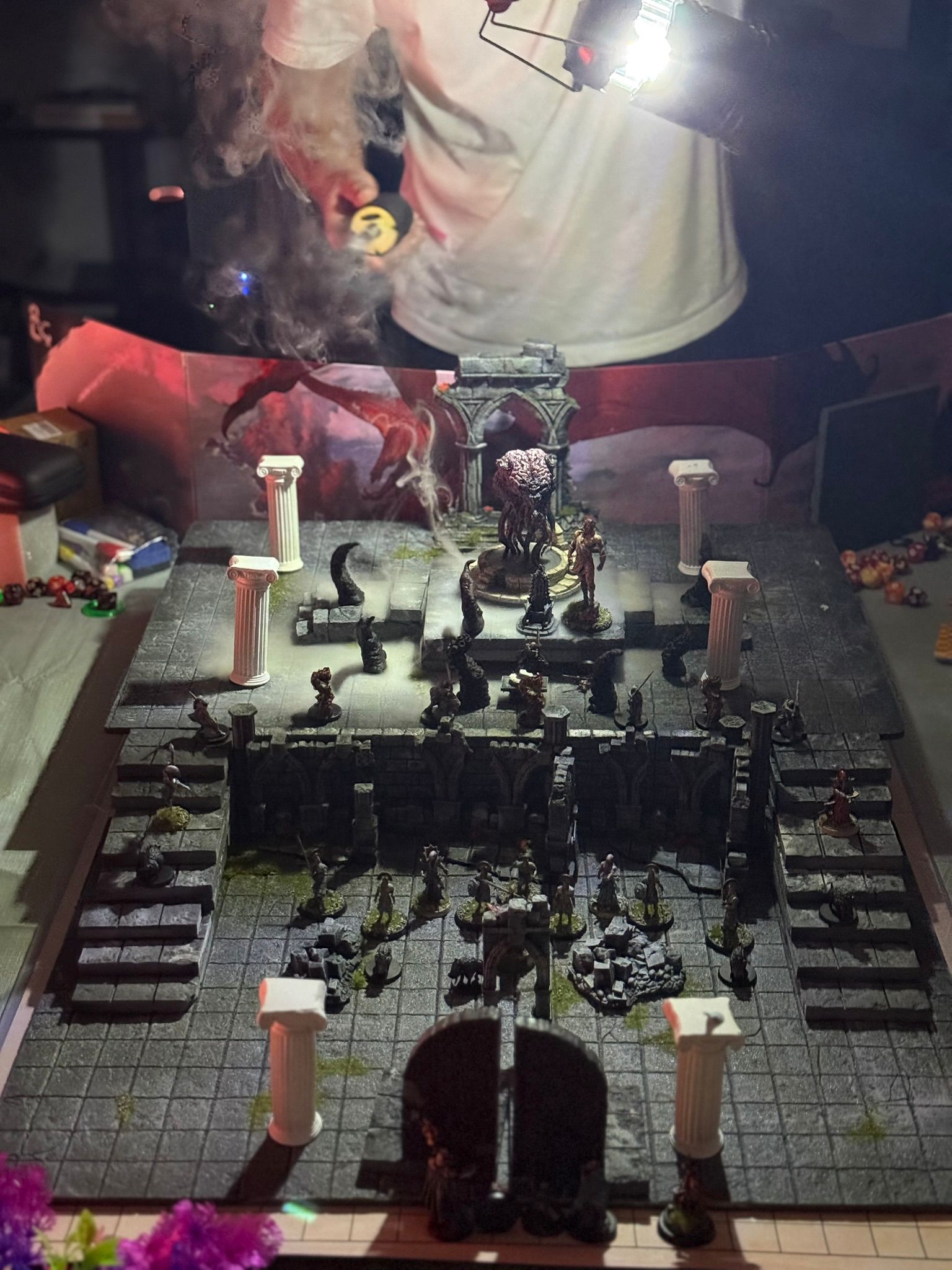 A large modular dungeon board with the party arrayed across it