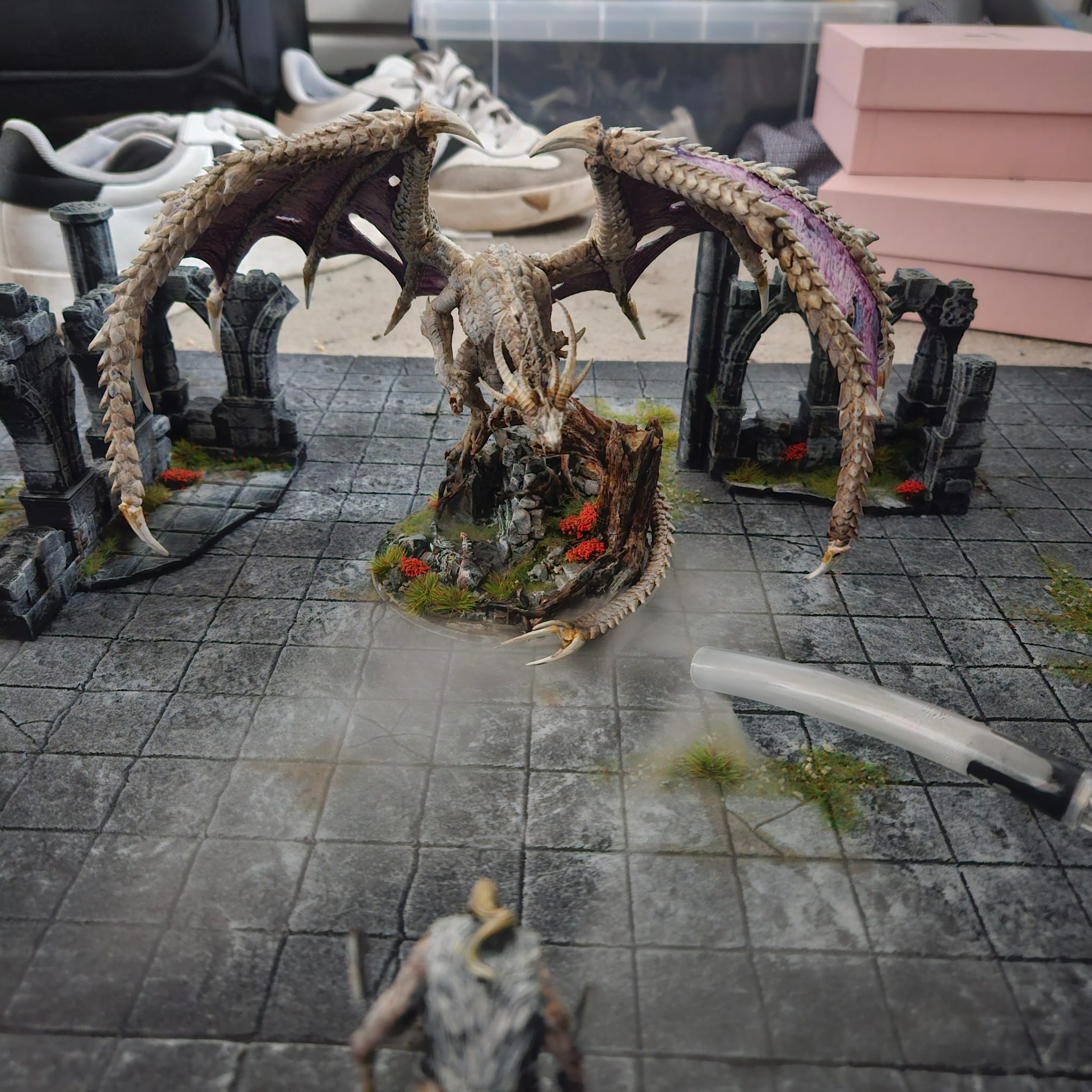A white dragon looming over dungeon tiles
